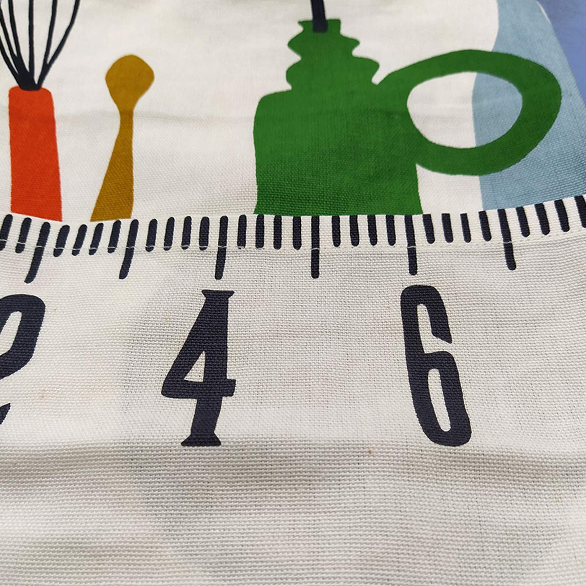 white cotton apron with a graphic print