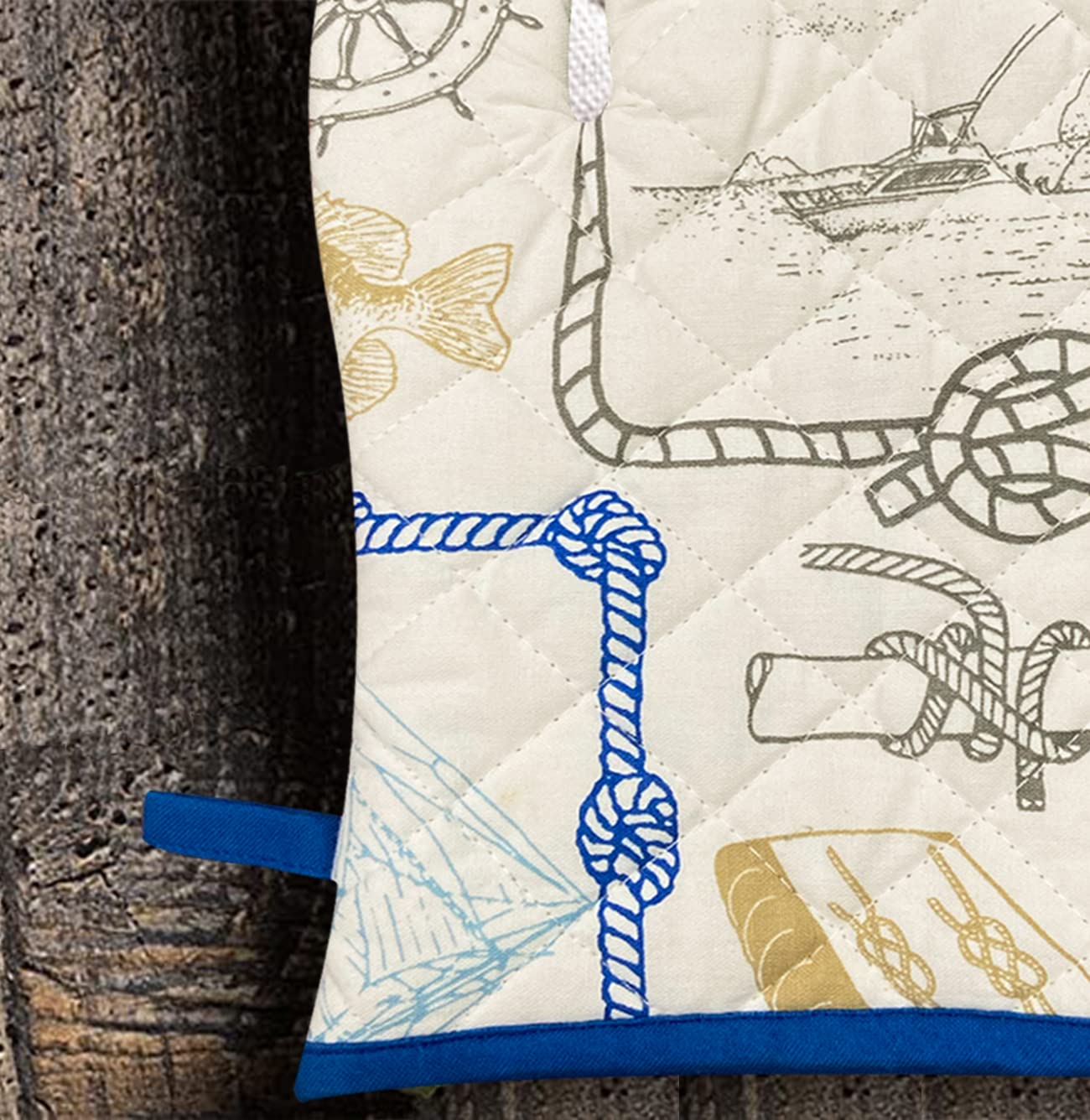 pair of white and blue oven gloves with a nautical pattern