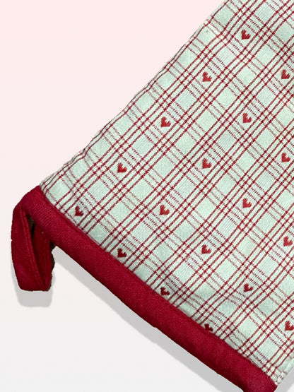white and red checkered oven glove